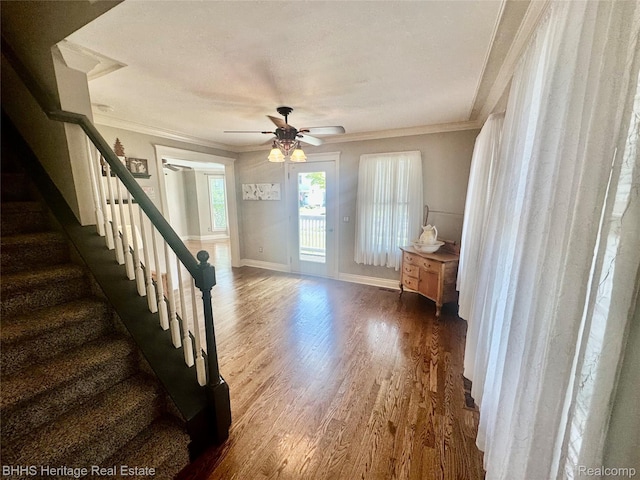 403 N Oak St, Durand, MI 48429 - foyer with dark wood finished floors, crown molding, a ceiling fan, and stairway