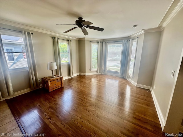 403 N Oak St, Durand, MI 48429 - unfurnished room featuring wood finished floors, a ceiling fan, and crown molding