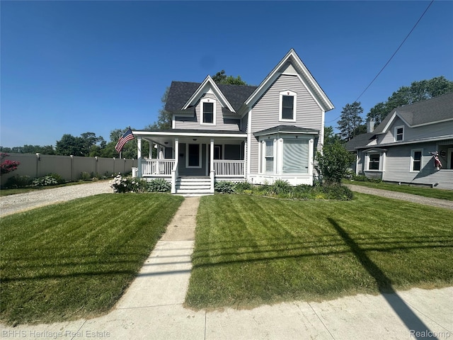 403 N Oak St, Durand, MI 48429 - victorian-style house with covered porch