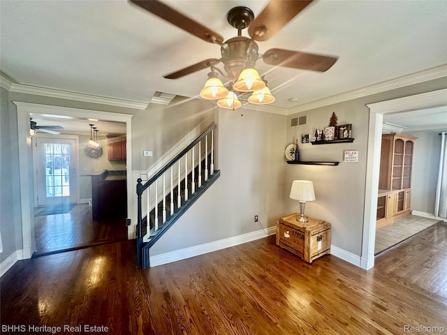 403 N Oak St, Durand, MI 48429 - empty room with a ceiling fan, wood finished floors, stairs, and crown molding