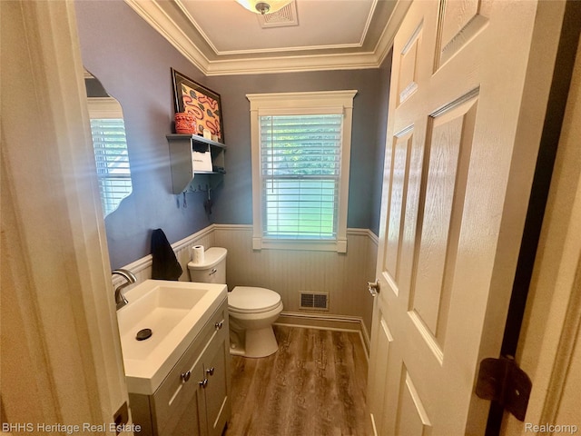 403 N Oak St, Durand, MI 48429 - bathroom with a wainscoted wall, vanity, plenty of natural light, wood finished floors, and ornamental molding