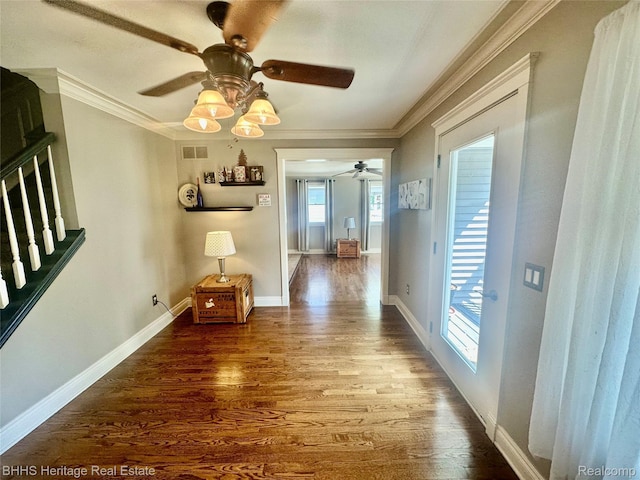 403 N Oak St, Durand, MI 48429 - hall featuring wood finished floors, ornamental molding, and stairs