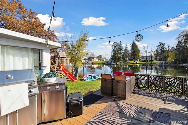 6003 Rolton Ct, Waterford, MI 48329 - wooden terrace featuring a water view, grilling area, and a playground
