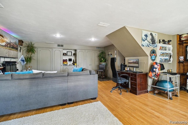 6003 Rolton Ct, Waterford, MI 48329 - living room featuring light wood-style flooring and an office area