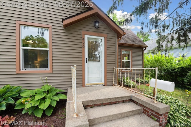 420 Wetmore St, Howell, MI 48843 - view of exterior entry featuring a shingled roof