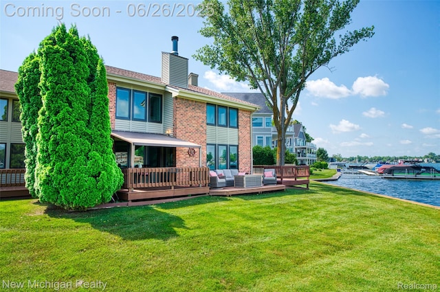 2226 Bowles St, Fenton, MI 48430 - back of house with an outdoor living space, a chimney, a yard, and brick siding