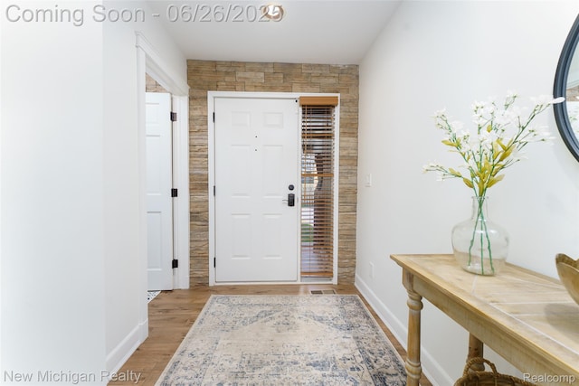 2226 Bowles St, Fenton, MI 48430 - foyer featuring wood finished floors and baseboards