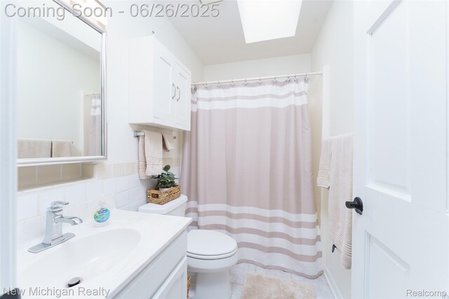 2226 Bowles St, Fenton, MI 48430 - bathroom featuring vanity, a skylight, and curtained shower
