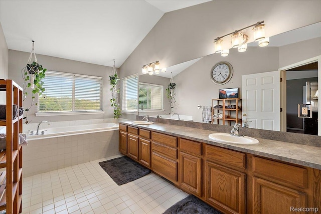 5390 Plantation Dr, Commerce Twp, MI 48382 - full bath with vaulted ceiling, double vanity, a bath, and tile patterned flooring