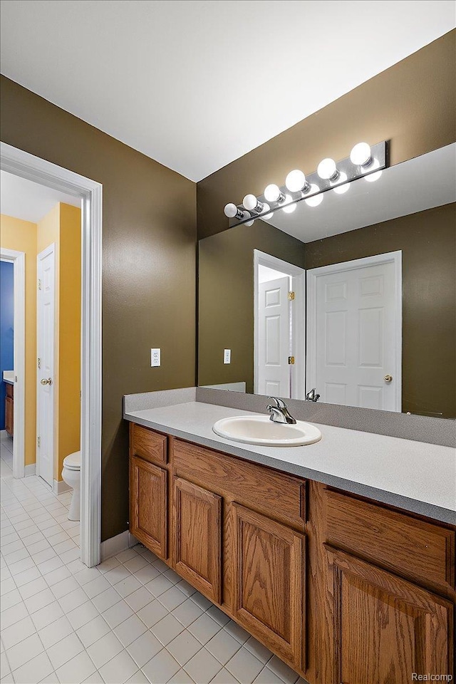 5390 Plantation Dr, Commerce Twp, MI 48382 - bathroom featuring vanity and tile patterned flooring