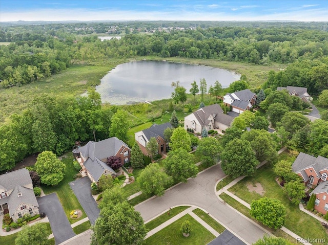 5390 Plantation Dr, Commerce Twp, MI 48382 - aerial view of residential area with a nearby body of water and a heavily wooded area