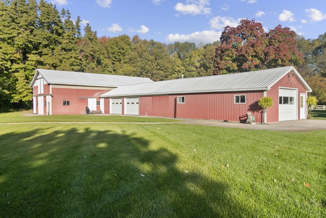 1532 34th St, Allegan, MI 49010 - view of front of property with a pole building, a detached garage, and a front lawn