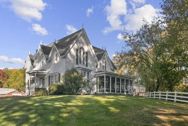 1532 34th St, Allegan, MI 49010 - view of home's exterior with a sunroom