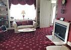 1532 34th St, Allegan, MI 49010 - carpeted living room featuring a fireplace