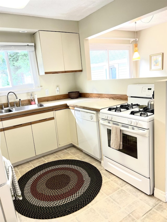 343 Bush Ave, Grand Blanc, MI 48439 - kitchen featuring white appliances, light countertops, and decorative light fixtures
