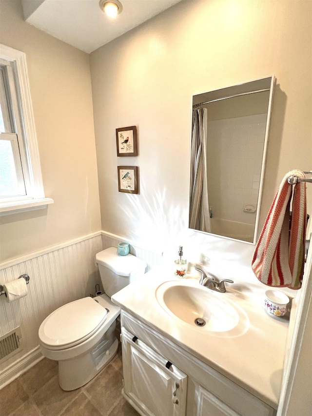 343 Bush Ave, Grand Blanc, MI 48439 - bathroom featuring vanity, a shower with shower curtain, a wainscoted wall, and tile patterned floors