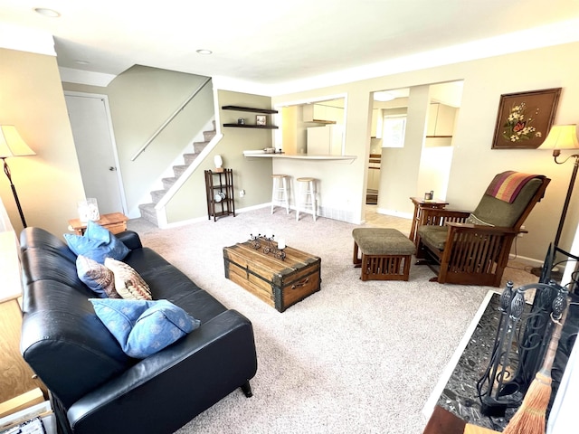 343 Bush Ave, Grand Blanc, MI 48439 - carpeted living area with stairway and baseboards