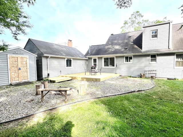 343 Bush Ave, Grand Blanc, MI 48439 - back of house with a storage unit, a deck, a yard, and a patio