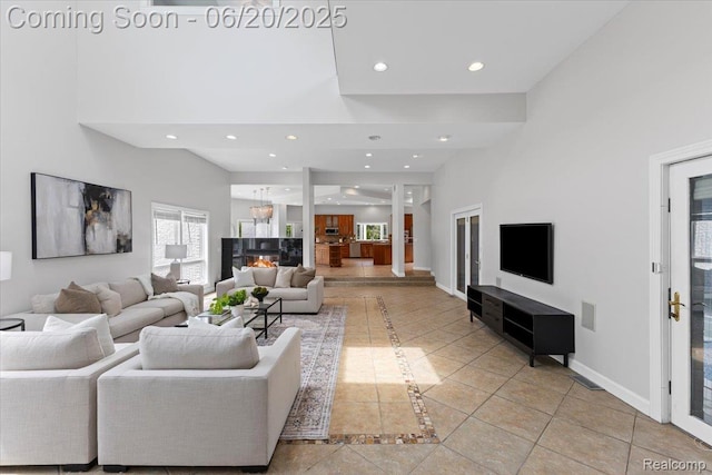 3440 Lone Pine Rd, West Bloomfield, MI 48323 - living room featuring light tile patterned floors, recessed lighting, and a high ceiling