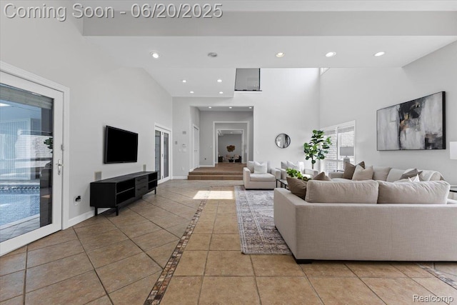 3440 Lone Pine Rd, West Bloomfield, MI 48323 - living room featuring inlaid floor details, recessed lighting, and a towering ceiling