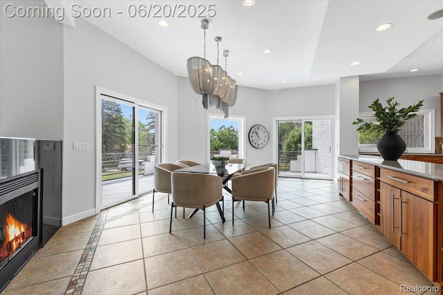 3440 Lone Pine Rd, West Bloomfield, MI 48323 - dining area featuring recessed lighting, healthy amount of natural light, light tile patterned floors, and a warm lit fireplace