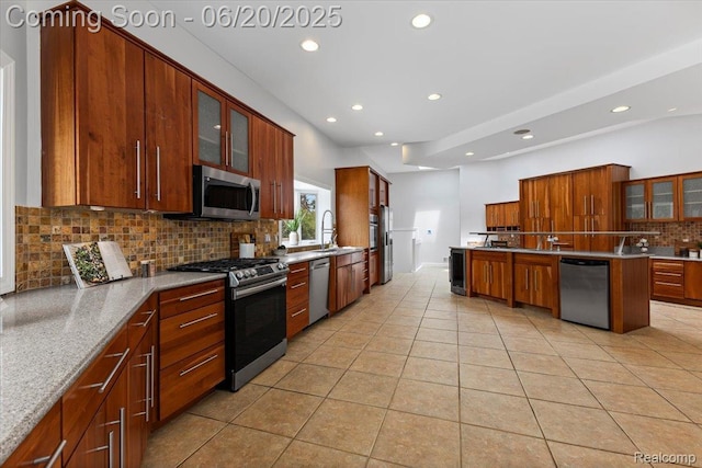 3440 Lone Pine Rd, West Bloomfield, MI 48323 - kitchen featuring stainless steel appliances, recessed lighting, decorative backsplash, light tile patterned flooring, and glass insert cabinets