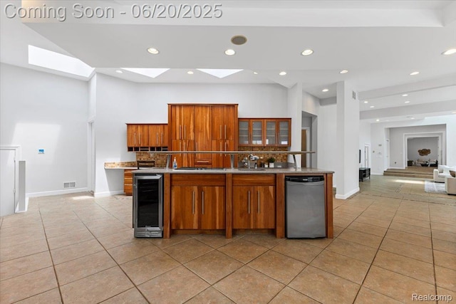 3440 Lone Pine Rd, West Bloomfield, MI 48323 - kitchen featuring beverage cooler, stainless steel appliances, brown cabinetry, light tile patterned flooring, and recessed lighting
