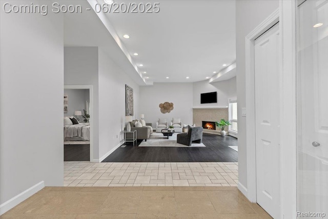 3440 Lone Pine Rd, West Bloomfield, MI 48323 - entrance foyer with tile patterned floors, recessed lighting, and a lit fireplace