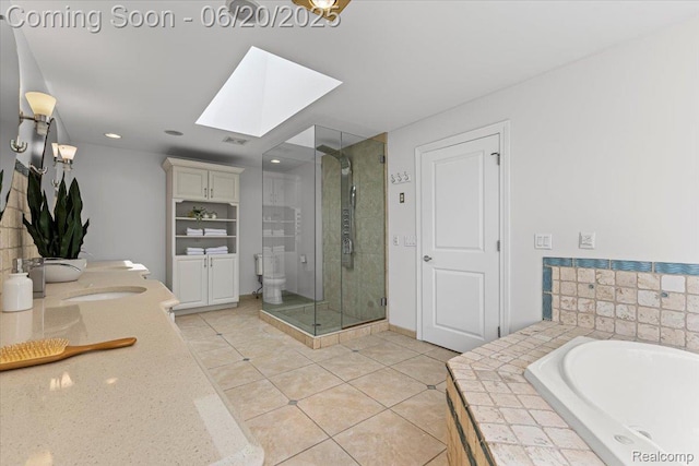 3440 Lone Pine Rd, West Bloomfield, MI 48323 - bathroom featuring double vanity, a shower stall, a skylight, tile patterned flooring, and a garden tub