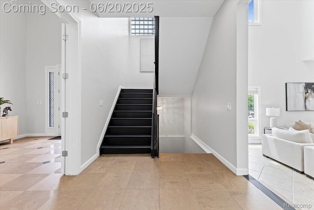 3440 Lone Pine Rd, West Bloomfield, MI 48323 - stairs featuring a towering ceiling and tile patterned floors