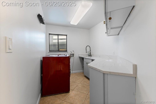 3440 Lone Pine Rd, West Bloomfield, MI 48323 - washroom with cabinet space, washer hookup, and light tile patterned flooring