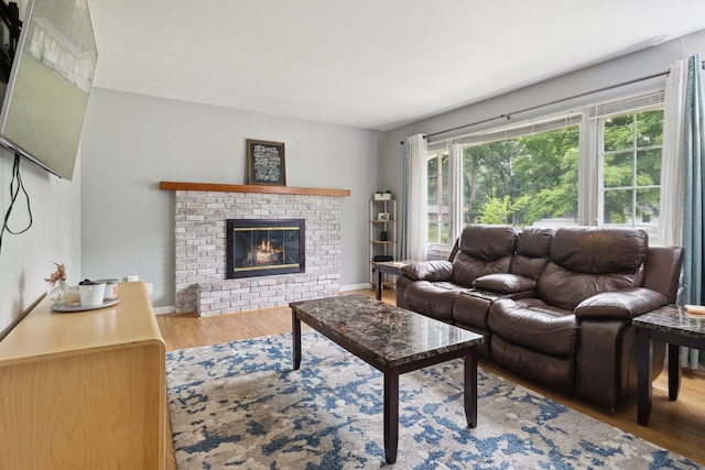 70838 Ridgewood Dr, Edwardsburg, MI 49112 - living area featuring wood finished floors and a fireplace