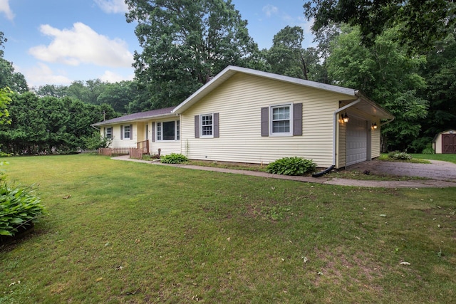 70838 Ridgewood Dr, Edwardsburg, MI 49112 - ranch-style house featuring driveway, a storage shed, and a front lawn