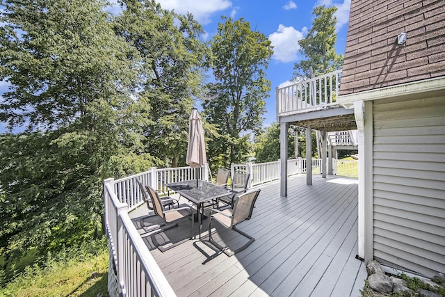 13674 Lenore Dr, Hudson, MI 49247 - wooden deck featuring outdoor dining area