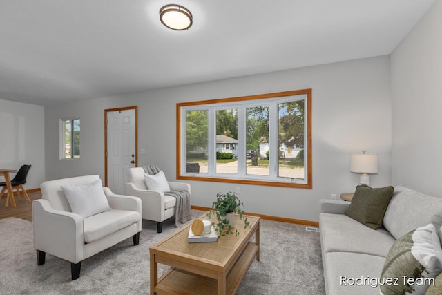 1235 Aurora Ave, Muskegon, MI 49442 - living room with baseboards and light carpet