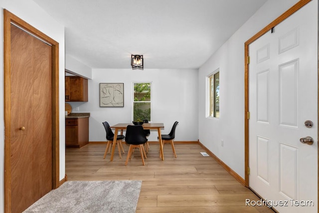 1235 Aurora Ave, Muskegon, MI 49442 - dining space with light wood-style floors and baseboards