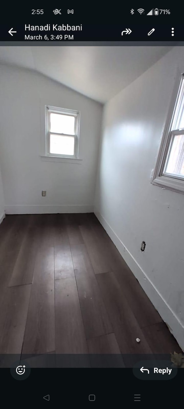 7761 Artesian St, Detroit, MI 48228 - unfurnished room with lofted ceiling, healthy amount of natural light, and dark wood finished floors