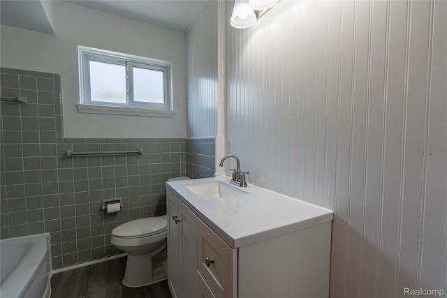 8177 Gary Ave, Westland, MI 48185 - full bathroom featuring vanity, a tub, wood finished floors, and a wainscoted wall