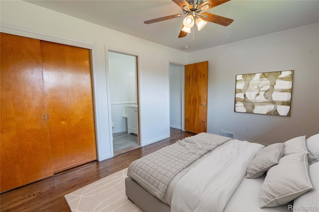 8177 Gary Ave, Westland, MI 48185 - bedroom with wood finished floors, a ceiling fan, and connected bathroom