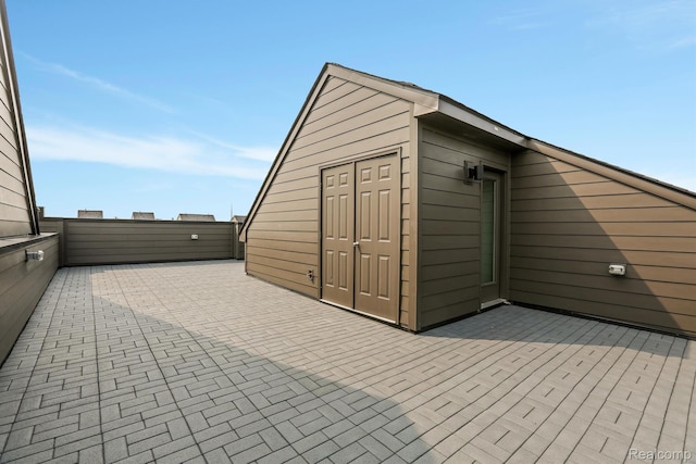 1058 Hampton Cir Unit 74, Detroit, MI 48207 - wooden terrace featuring a patio