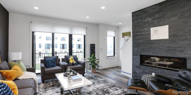 1058 Hampton Cir Unit 74, Detroit, MI 48207 - living room with wood finished floors, recessed lighting, a glass covered fireplace, and french doors