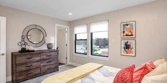 1058 Hampton Cir Unit 74, Detroit, MI 48207 - bedroom featuring light carpet and recessed lighting