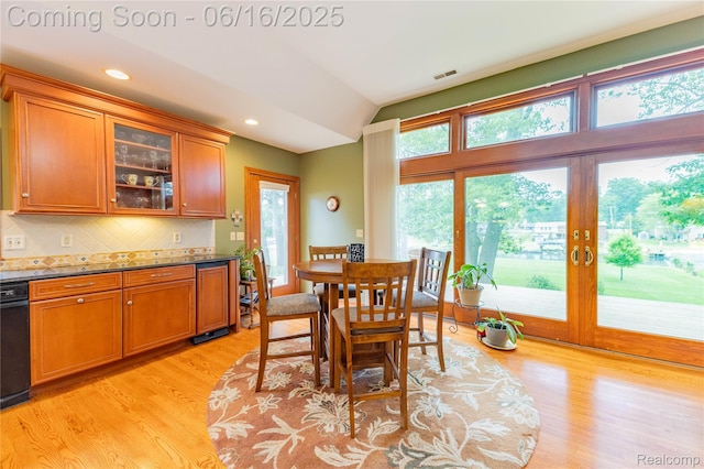 21781 Thorofare Rd, Grosse Ile, MI 48138 - dining area with light wood-type flooring, vaulted ceiling, and recessed lighting