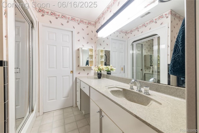 21781 Thorofare Rd, Grosse Ile, MI 48138 - bathroom with wallpapered walls, vanity, a stall shower, and tile patterned floors