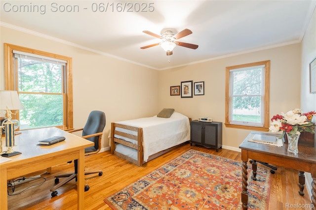 21781 Thorofare Rd, Grosse Ile, MI 48138 - bedroom featuring multiple windows, ornamental molding, light wood finished floors, and a desk
