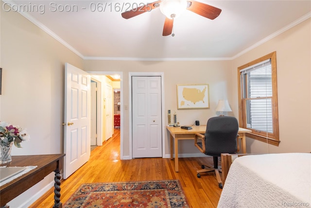 21781 Thorofare Rd, Grosse Ile, MI 48138 - bedroom with light wood-style floors, ornamental molding, an office area, a ceiling fan, and a closet