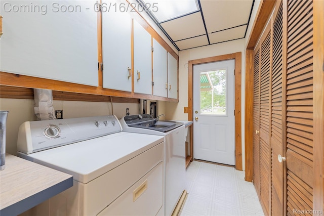 21781 Thorofare Rd, Grosse Ile, MI 48138 - laundry room with cabinet space, washer and clothes dryer, and light flooring