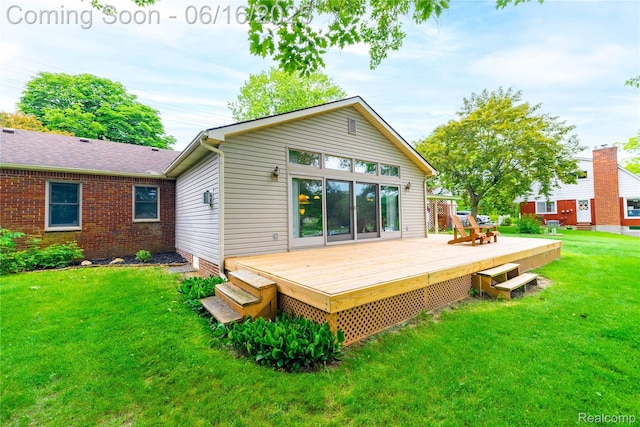21781 Thorofare Rd, Grosse Ile, MI 48138 - back of property with a wooden deck and a lawn
