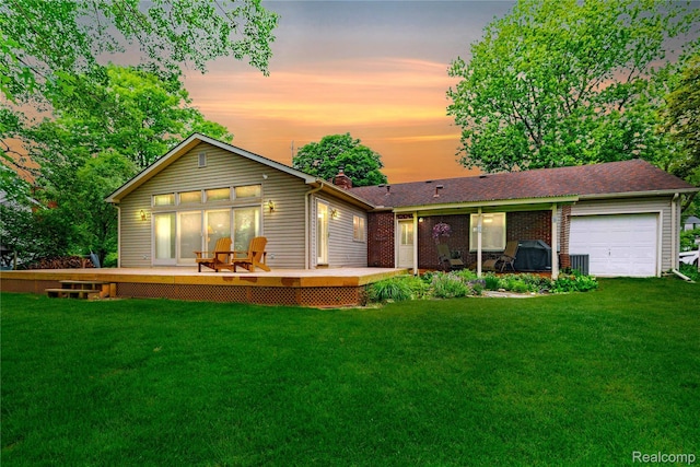 21781 Thorofare Rd, Grosse Ile, MI 48138 - rear view of house featuring a chimney, a yard, a wooden deck, and a garage