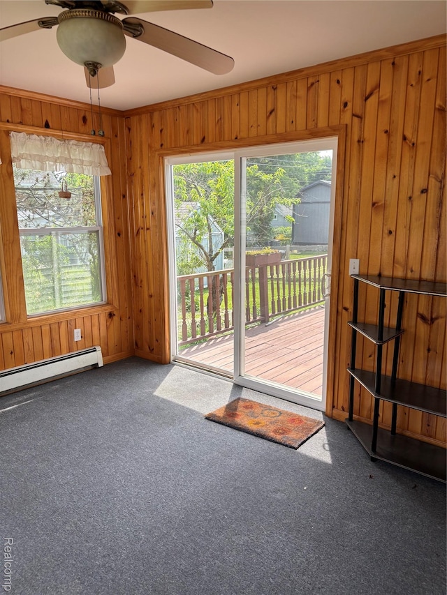 59 W High St, Metamora, MI 48455 - interior space featuring carpet floors, a ceiling fan, baseboard heating, and wooden walls